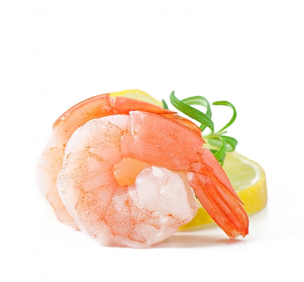 Two tail of shrimp with fresh lemon and rosemary on the white