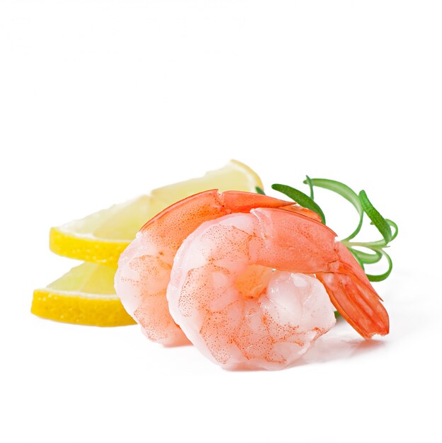 Two tail of shrimp with fresh lemon and rosemary on the white