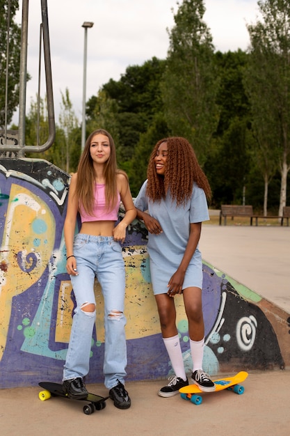 Two teenage girls spending time together at the skating rink