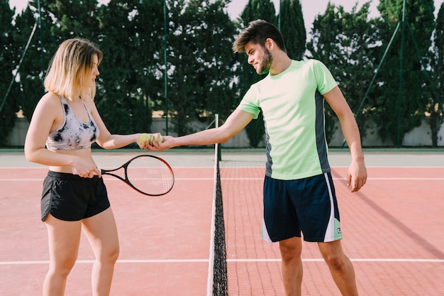 Free photo two tennis players shaking hands