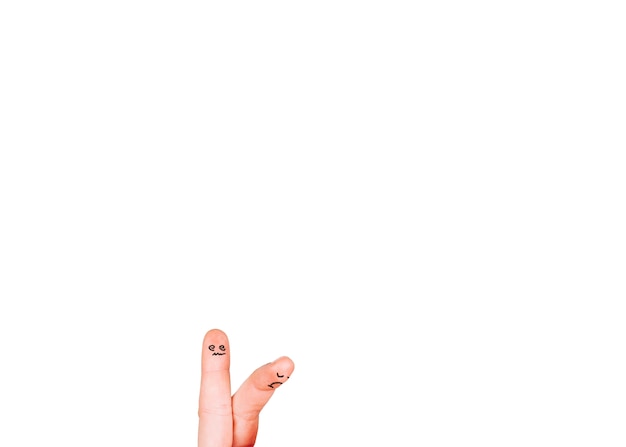 Two upset fingers on white background
