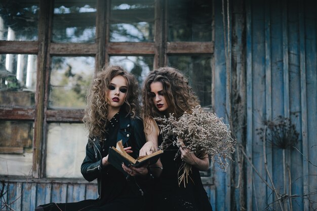 Two vintage witches gathered for the sabbat eve of Halloween