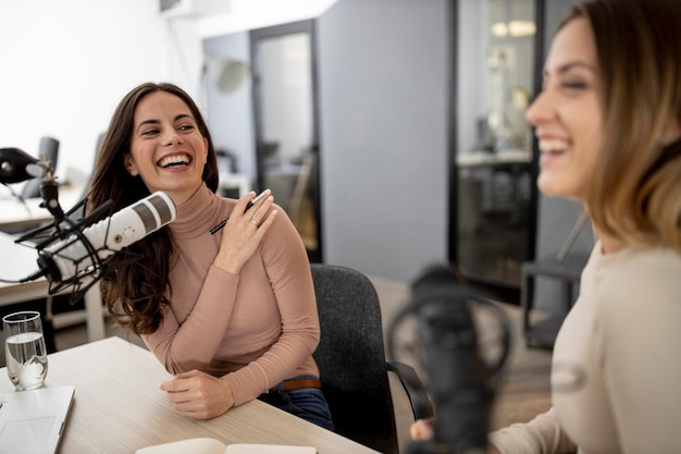 Two women broadcasting on radio together