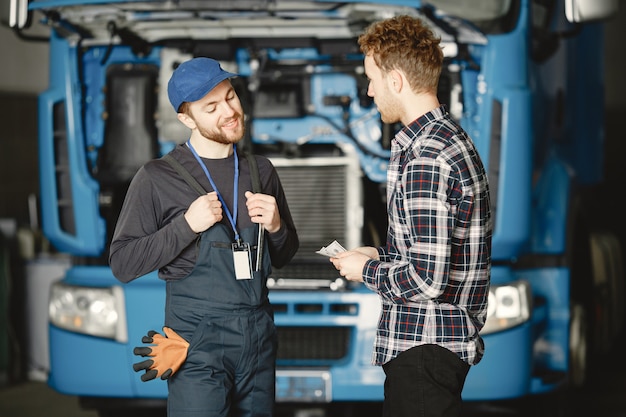 Two workers in uniform. Workers with tools. Working day.