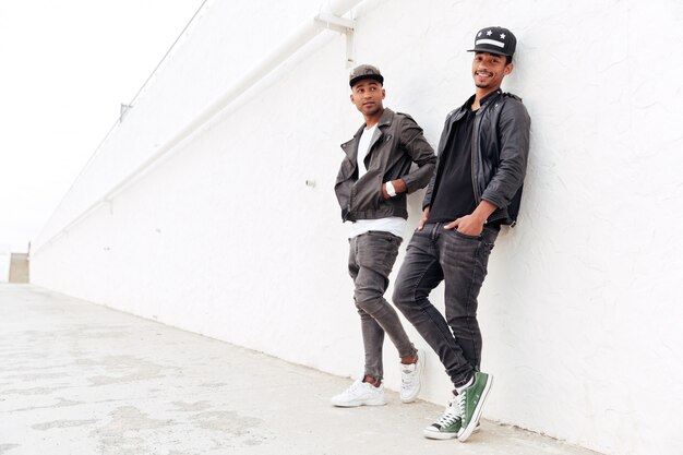 Two young african men friends standing outdoors