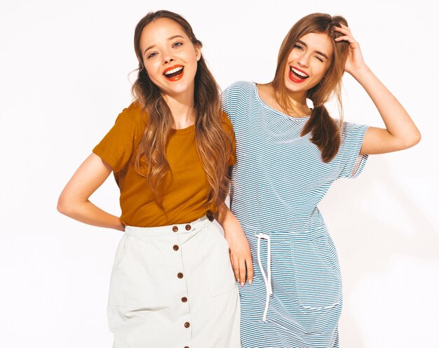 two young beautiful smiling girls in trendy summer casual clothes. sexy carefree women. positive models