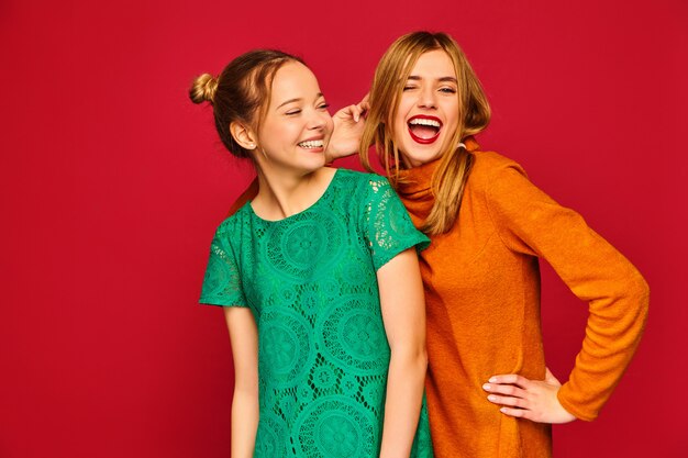 Two young beautiful women posing in trendy clothes