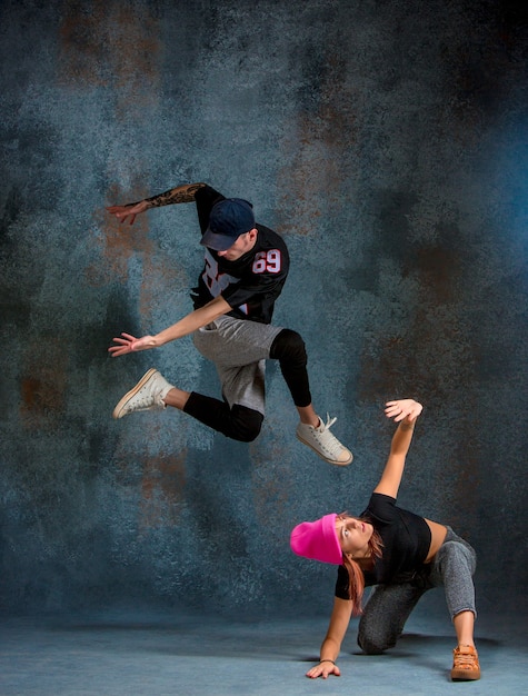 The two young girl and boy dancing hip hop 