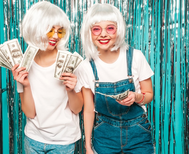 Two young sexy hipster girls in white wigs and red lips.Beautiful trendy women in summer clothes summer  having fun