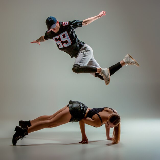 The two young woman and boy dancing hip hop