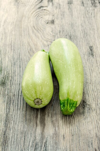 The two zucchini on wooden table