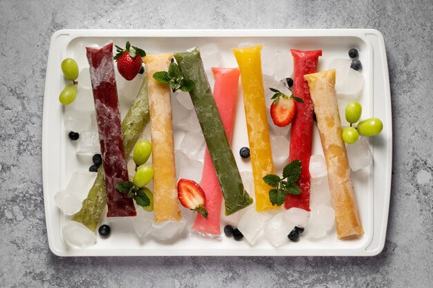 Free photo typical brazilian freezies with fruits still life