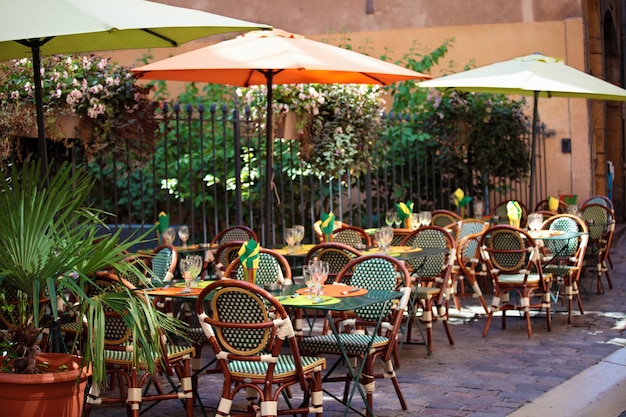 Typical french restaurant scene of tables and chairs 