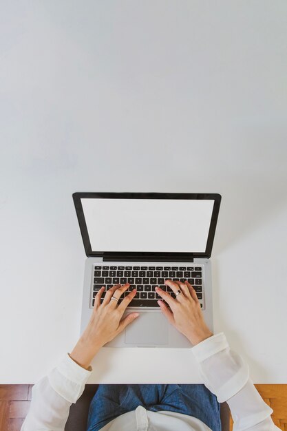 Typing on laptop top view