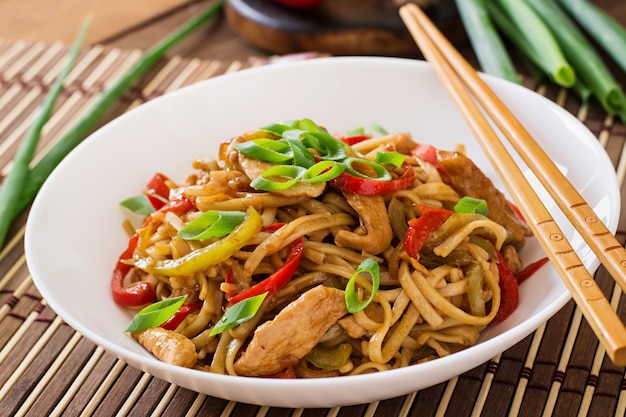 Udon noodles with chicken and peppers. Japanese cuisine