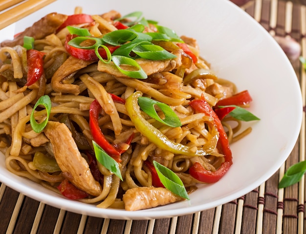 Udon noodles with chicken and peppers. Japanese cuisine