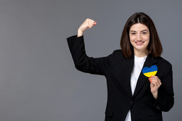 Ukraine russian conflict brunette pretty cute girl in black blazer strong with ukrainian heart