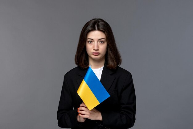 Ukraine russian conflict dark hair cute young woman in black blazer upset and crying