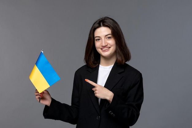 Ukraine russian conflict gorgeous young dark hair woman in black blazer happy for ukraine victory