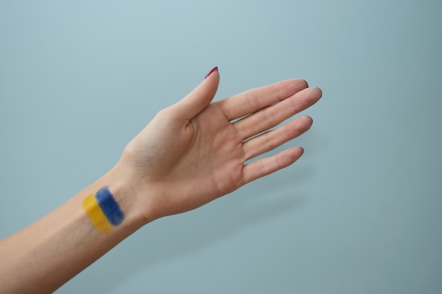 Free photo ukrainian flag on wrist