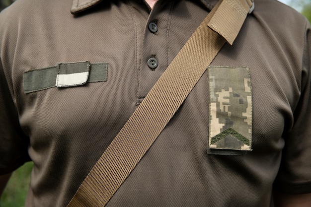 Free photo ukrainian soldier wearing uniform front view