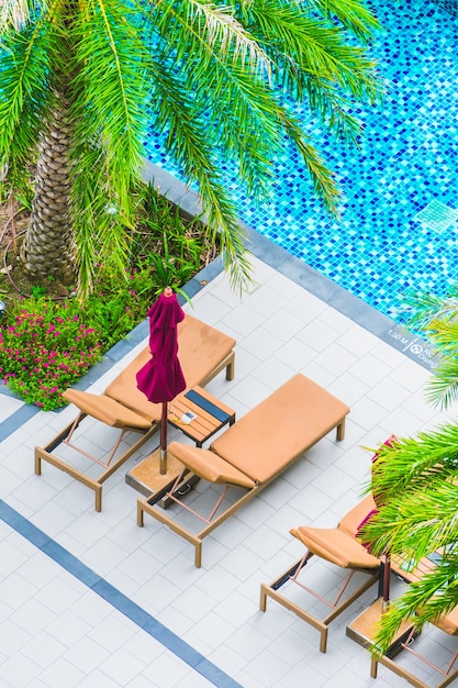 Umbrella chair around swimming pool