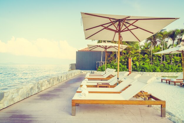 Umbrella and chair with sea view