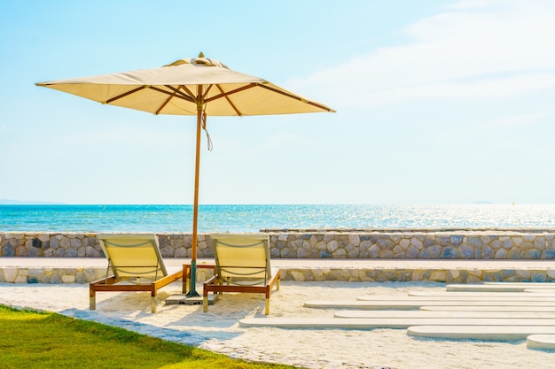 Umbrella and chair with sea view