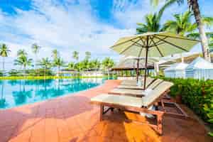 Free photo umbrella and hammocks in a pool