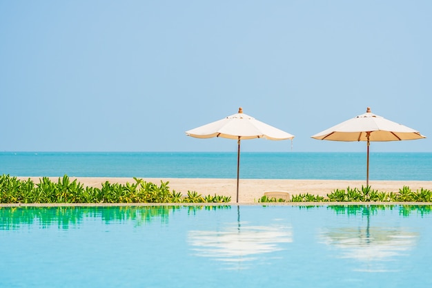 Umbrellas around outdoor swimming pool