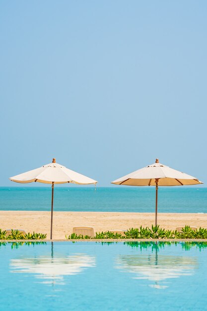 Umbrellas around outdoor swimming pool