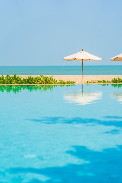 Umbrellas around outdoor swimming pool