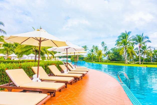 Umbrellas and hammocks near a large pool