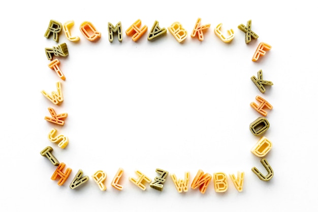 Uncooked alphabet pasta frame