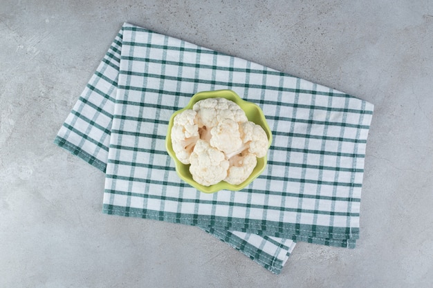 Uncooked fresh cauliflower vegetable on a tablecloth . High quality photo