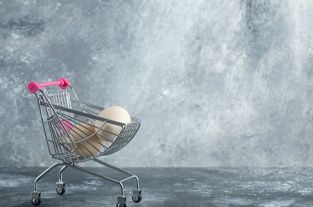 Uncooked organic eggs in metal trolley