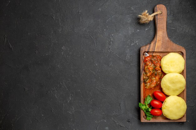 Uncooked vegetables on a brown cutting board