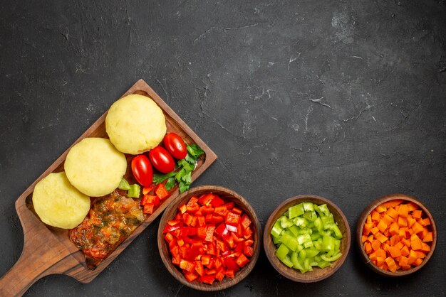 Uncooked vegetables on a brown cutting board