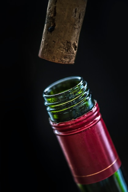 Uncorking a bottle of red wine