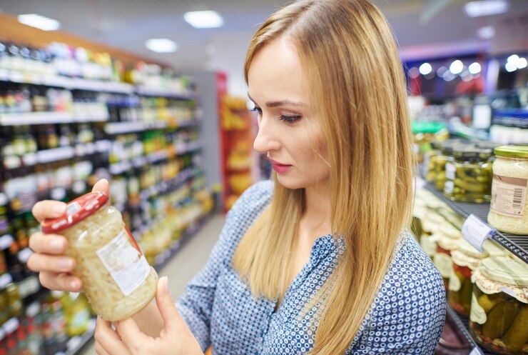 A woman reading a product label