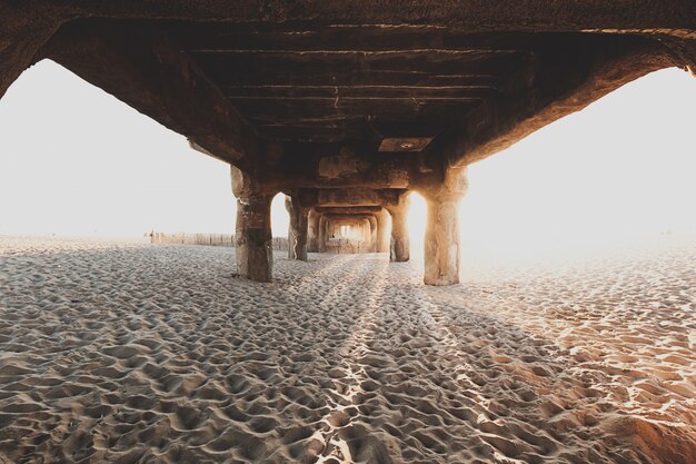 Underneath the wooden bridge at sandy beach