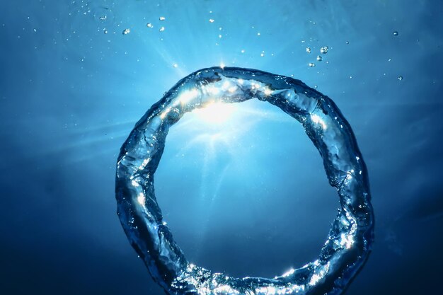 Underwater Bubble Ring Ascends towards the Sun