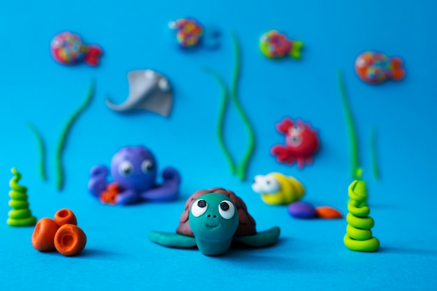 Underwater play dough background with turtle