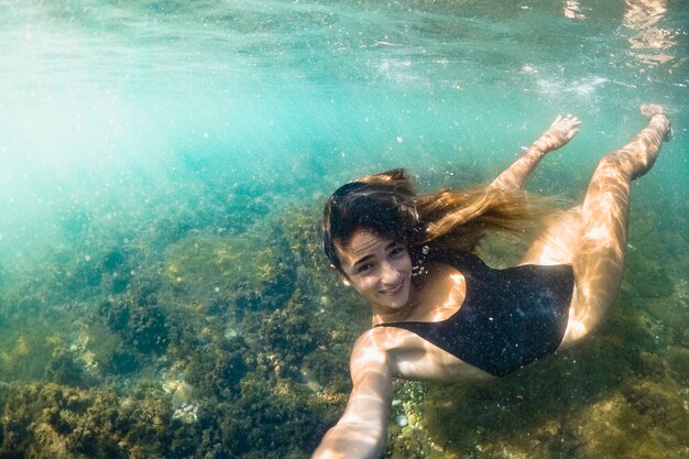 Underwater shot of woman diving