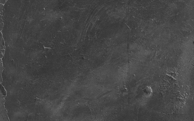 Uneven black grungy cement surface