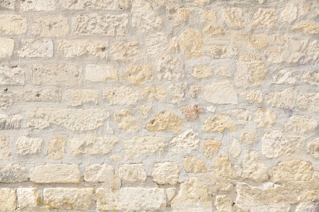 Free photo uneven brick wall in light colors