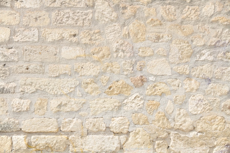 Free Photo uneven brick wall in light colors