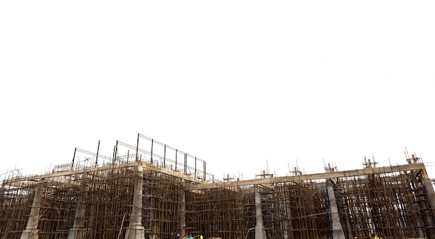 Unfinished building construction site isolated on white backgrou