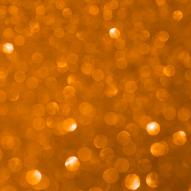 Unfocused orange glitter background