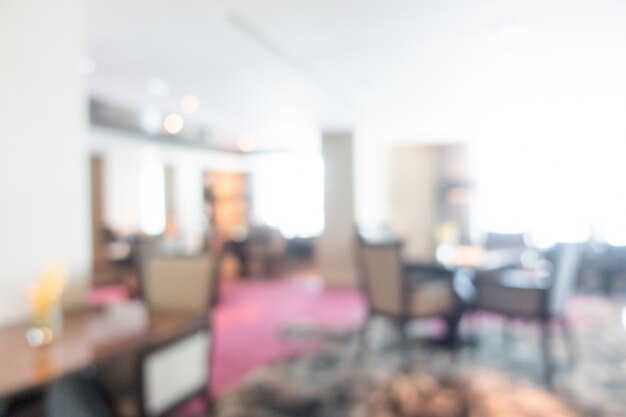 Unfocused restaurant with dark wooden chairs
